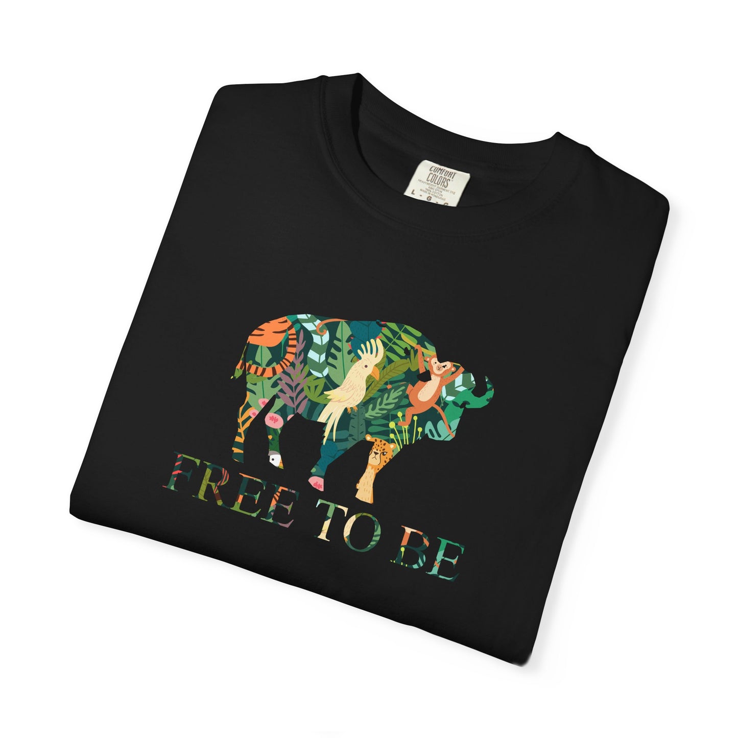 Folded Black t-shirt with a colorful buffalo and 'FREE TO BE' text on a white background