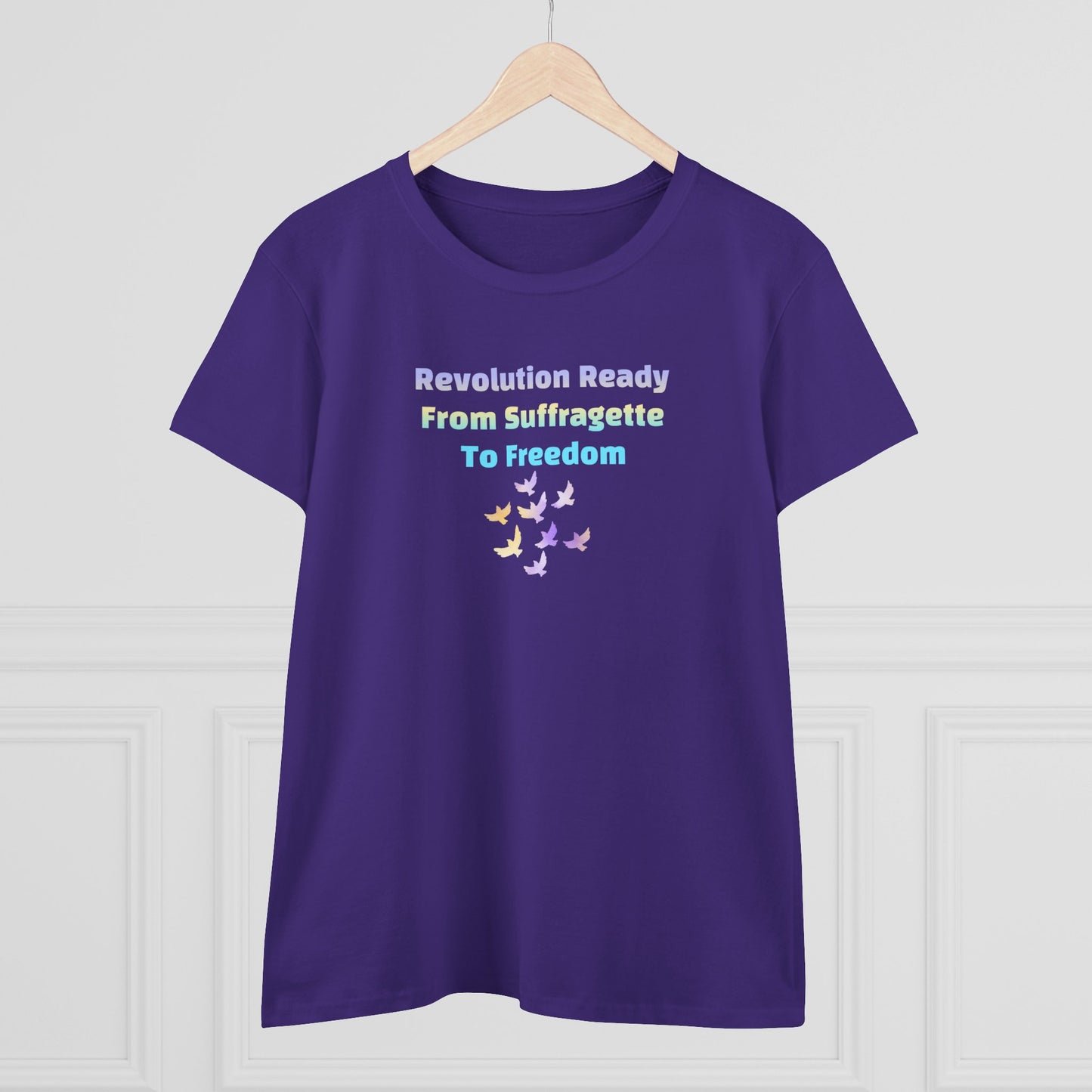Purple t-shirt with text of Revolution Ready From Suffragette To Freedom and dove graphics on a white background