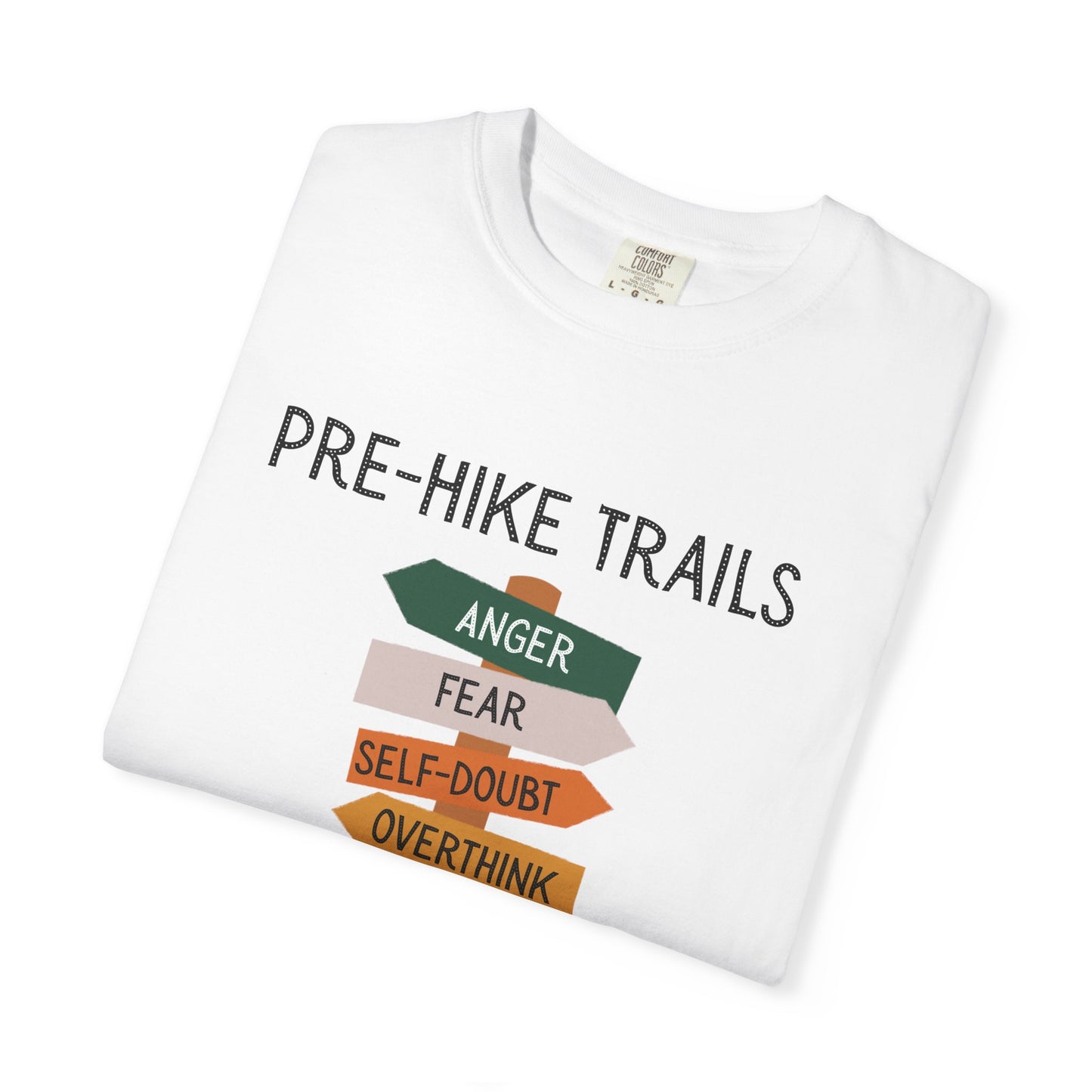 Folded white t-shirt with 'Pre-Hike Trails' graphic and text on a white background
