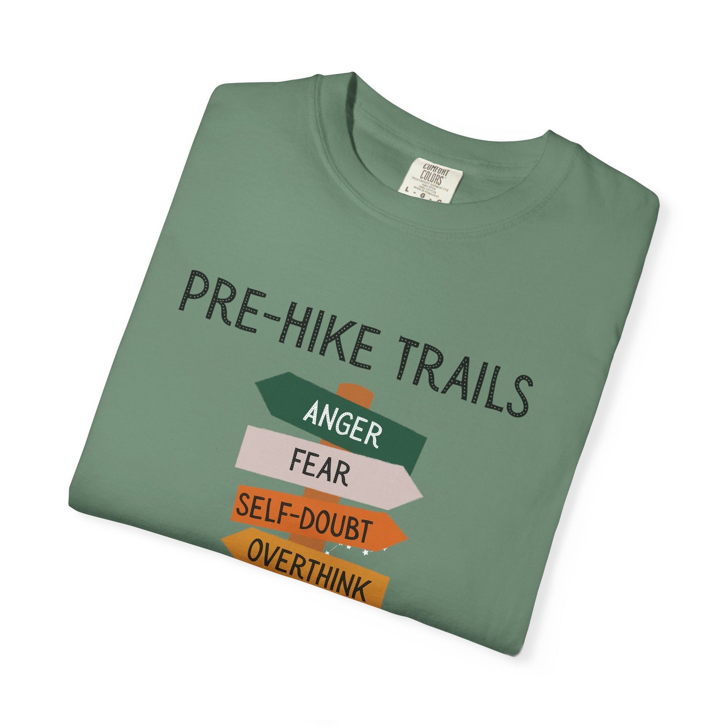 Folded green t-shirt with humorous text design on a white background