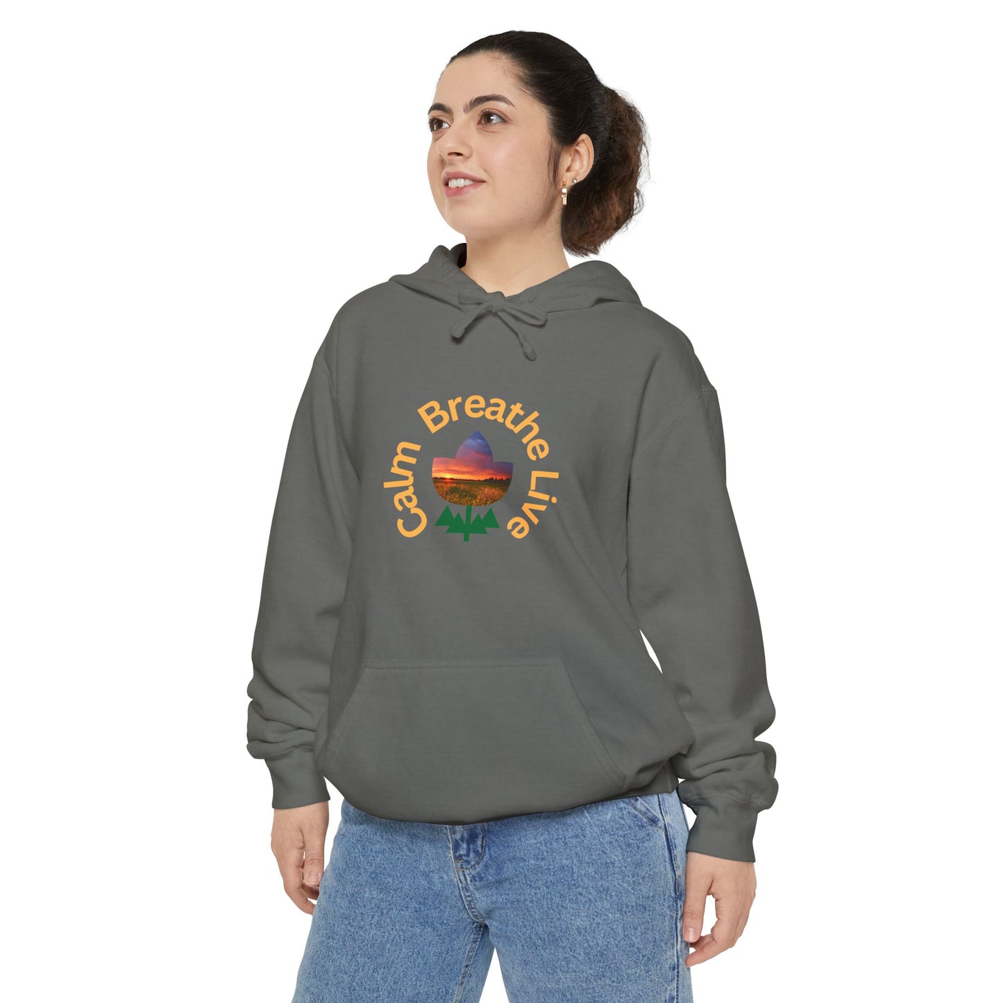 Person wearing a gray hoodie with a colorful graphic and text on a white background
