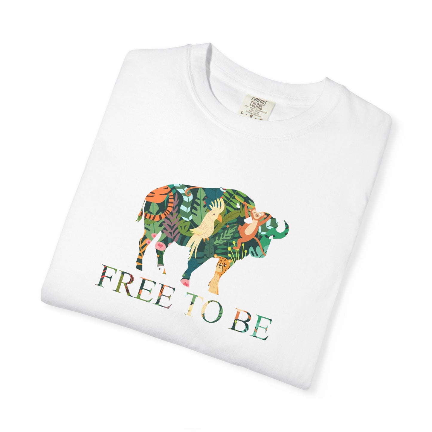 Folded White t-shirt with a colorful graphic of a buffalo and text 'FREE TO BE' on a white background