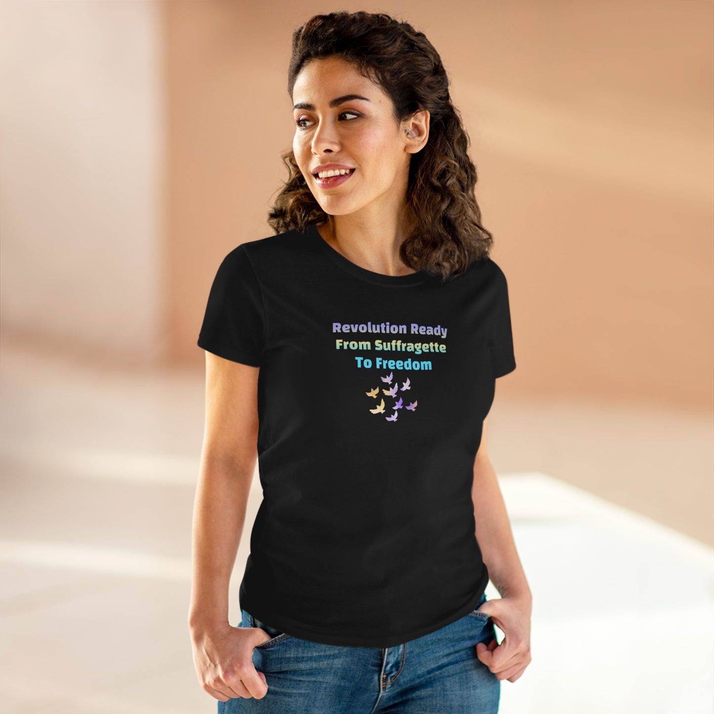 Woman wearing a black t-shirt with text and colorful design on a beige background