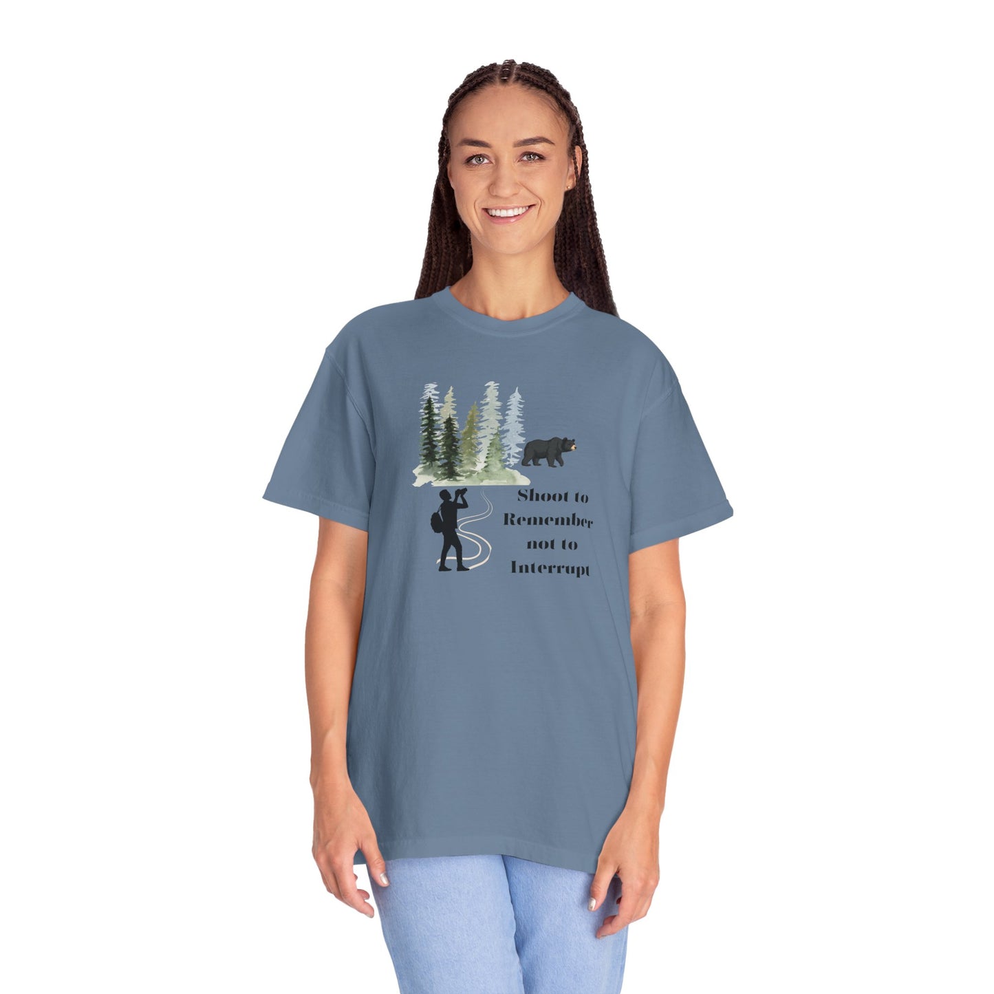 Woman wearing a blue t-shirt with a graphic design and text on a white background