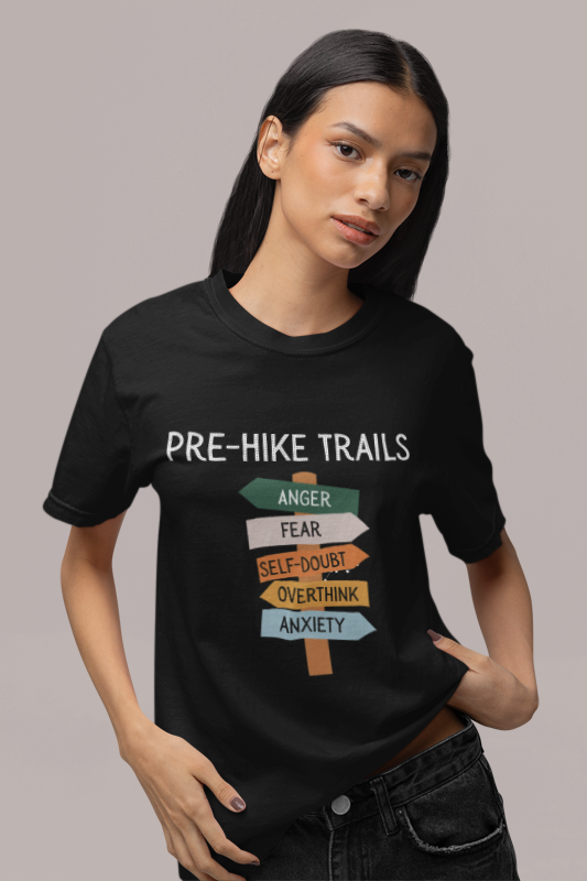 Person wearing a black t-shirt with 'Pre-Hike Trails' graphic design.