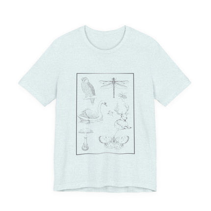 A light mint green heathered short-sleeve t-shirt with a black line art graphic of various nature illustrations (owl, dragonfly, swan, deer, mushroom, butterfly) inside a rectangular border on the front, displayed on a clean white background.