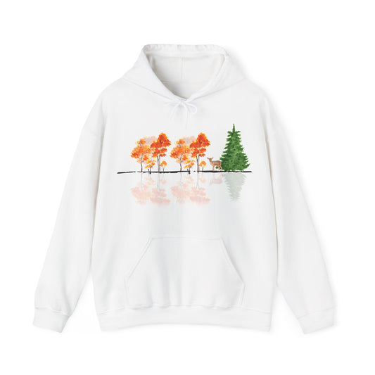 White hoodie with a nature-themed design on a white background. Reflective trees and fawn on front.