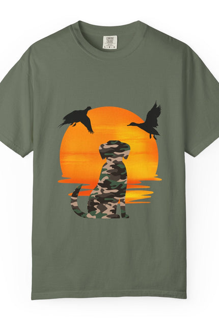 Green t-shirt with a camouflage dog and ducks design on an orange sunset background