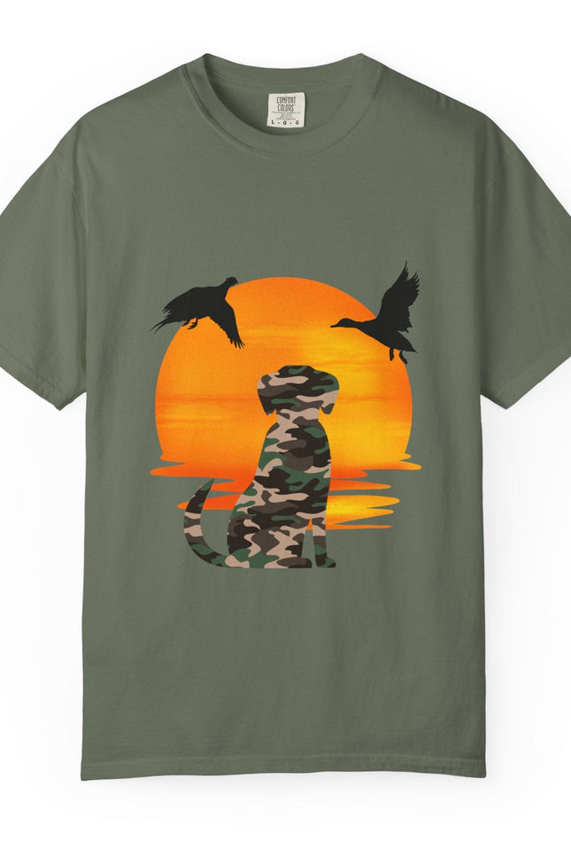 Green t-shirt with a camouflage dog and ducks design on an orange sunset background