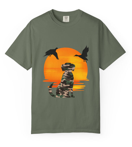 Green t-shirt with a camouflage dog and ducks design on an orange sunset background