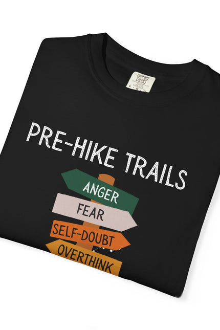 Folded Black t-shirt with 'Pre-Hike Trails' text and directional signs on a white background