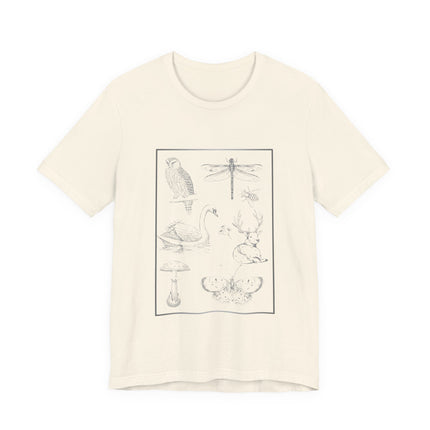 An off-white short-sleeve crewneck t-shirt featuring a black line art graphic of various woodland animals and nature motifs, including a dragonfly, owl, duck, swan, deer, mushroom, and butterfly, arranged inside a thin rectangular border.