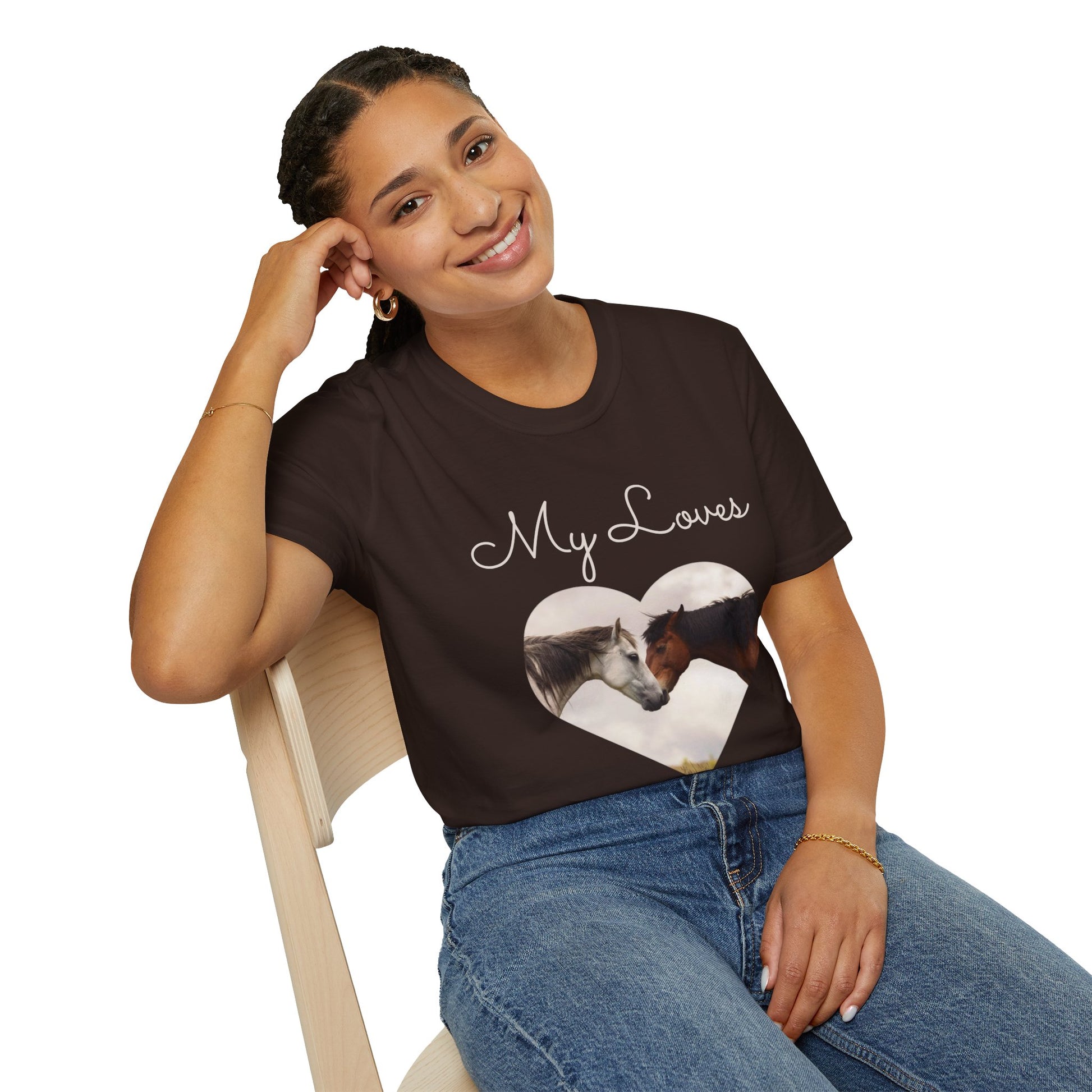 Woman sitting in a chair posting with the t-shirt stating My Loves with horses.