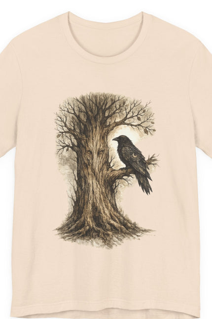 Beige t-shirt with a tree and bird design on a white background