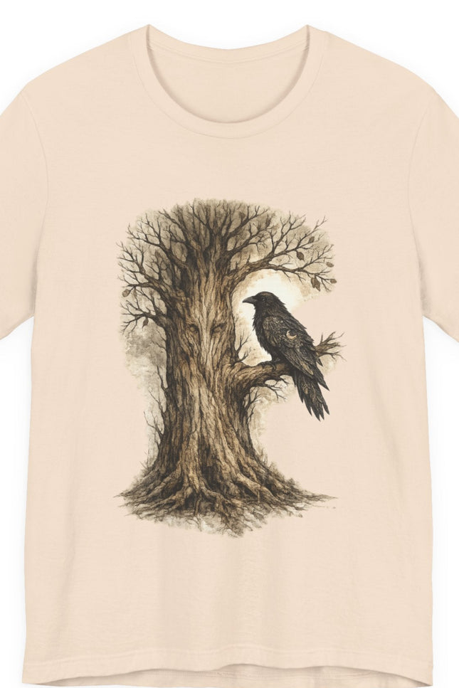 Beige t-shirt with a tree and bird design on a white background