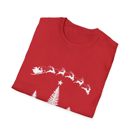 Folded red t-shirt with Santa's sleigh and reindeer flying over an evergreen tree with a star.  White background.