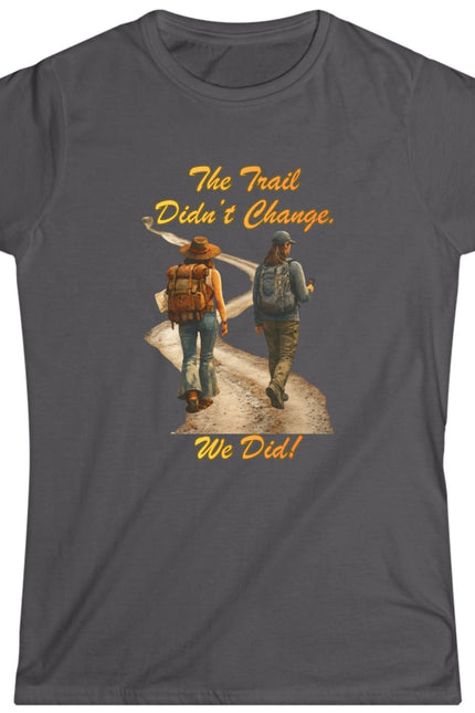 Gray t-shirt with graphic of two hikers and text on a white background
