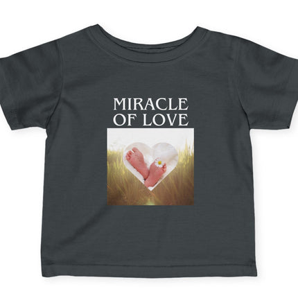 Black t-shirt with 'Miracle of Love' text and baby feet graphic on a white background