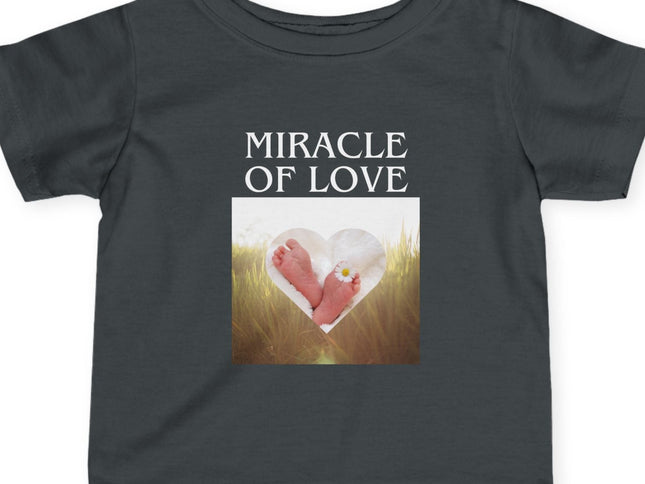 Black t-shirt with 'Miracle of Love' text and baby feet graphic on a white background