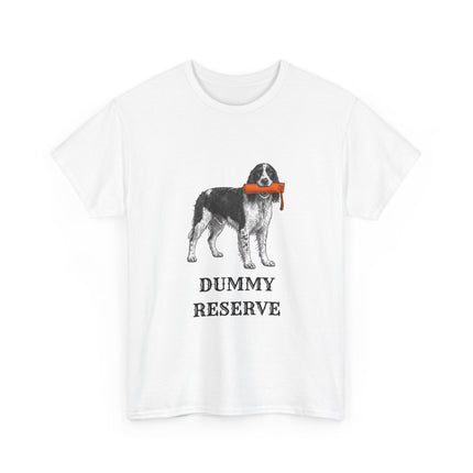 A white short-sleeve crewneck t-shirt featuring a graphic of a black and white Springer Spaniel dog holding an orange training dummy in its mouth, with the text 'DUMMY RESERVE' printed below in black.