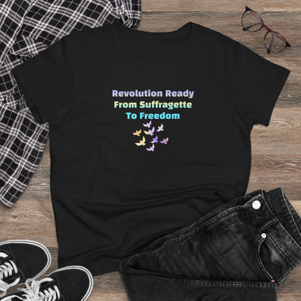 Black t-shirt with colorful text and butterfly design on a wooden surface with jeans and sneakers.