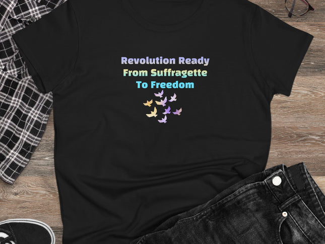 Black t-shirt with colorful text and butterfly design on a wooden surface with jeans and sneakers.
