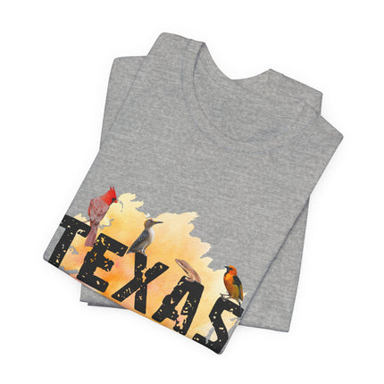 Folded gray tee with 'Texas' design featuring birds on a white background