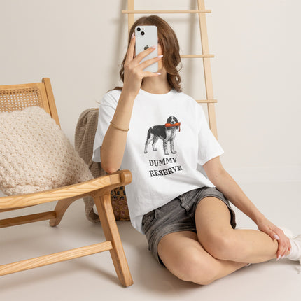 Person wearing a white t-shirt with a springer spaniel graphic and text, sitting on the floor.