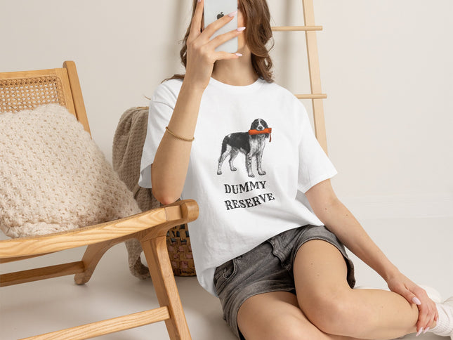 Person wearing a white t-shirt with a springer spaniel graphic and text, sitting on the floor.