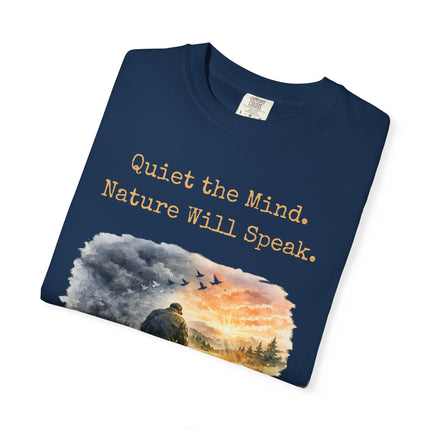 Folded navy blue t-shirt with nature-themed design and text on a white background