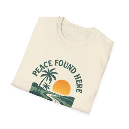 Folded t-shirt with 'Peace Found Here' graphic design on a white background