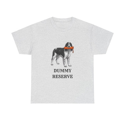 A light gray short-sleeve crewneck t-shirt featuring a graphic of a black and white Springer Spaniel dog holding an orange training dummy in its mouth, with the text 'DUMMY RESERVE' printed below in black.
