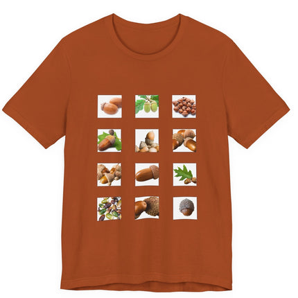 Brown t-shirt with nature-themed design featuring acorns and leaves on a white background