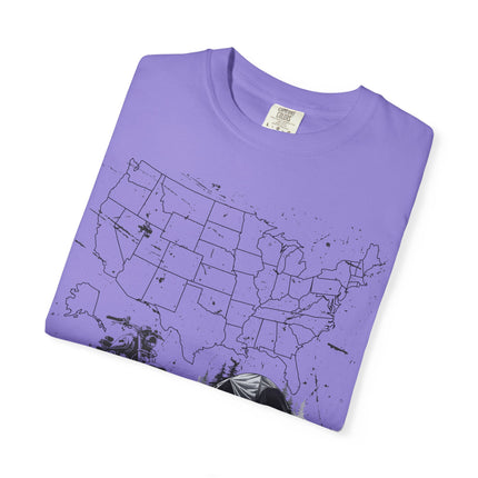 Folded purple t-shirt with a black map of the United States on a white background