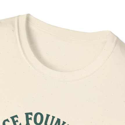 Close-up of a tagless beige fabric texture with green text on a white background
