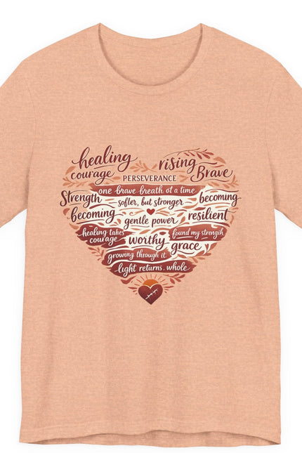 Peach t-shirt with motivational quote design on a white background