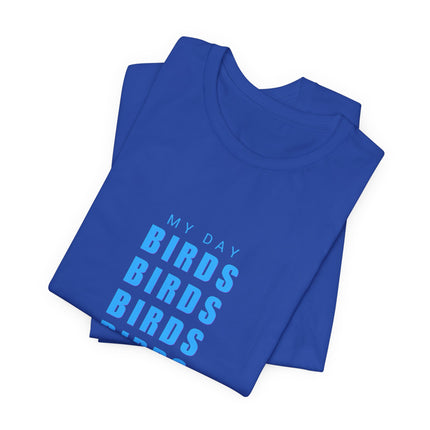 A folded royal blue t-shirt with a light blue graphic text print reading 'MY DAY BIRDS BIRDS BIRDS' on a plain white background.