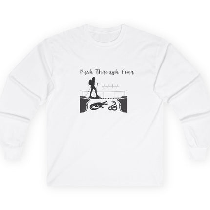 White long sleeved tee with black graphic showing hiker going over bridge with alligator and snake. Text states "Push through Fear."