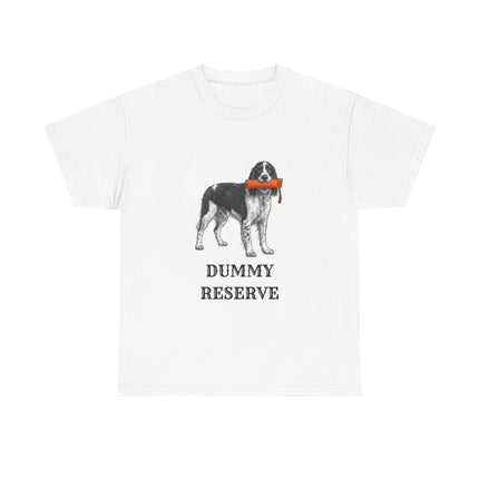 A white short-sleeve crewneck t-shirt featuring a graphic of a black and white Springer Spaniel dog holding an orange training dummy in its mouth, with the text 'DUMMY RESERVE' printed below in black.