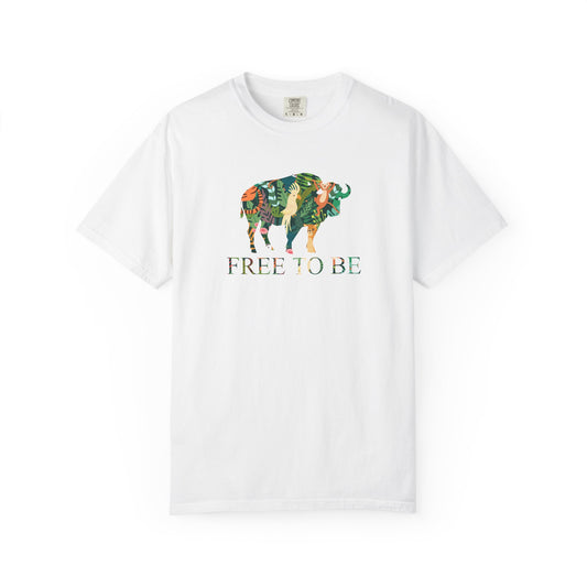White t-shirt with a colorful graphic of a buffalo and text 'FREE TO BE' on a white background