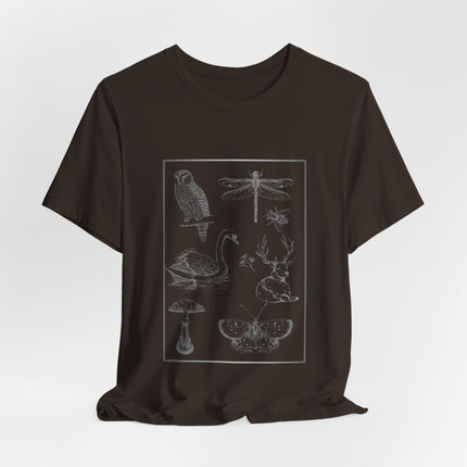 Dark t-shirt with drawings of an owl, dragonfly, bee, swan, deer, flowers, mushroom and butterfly.