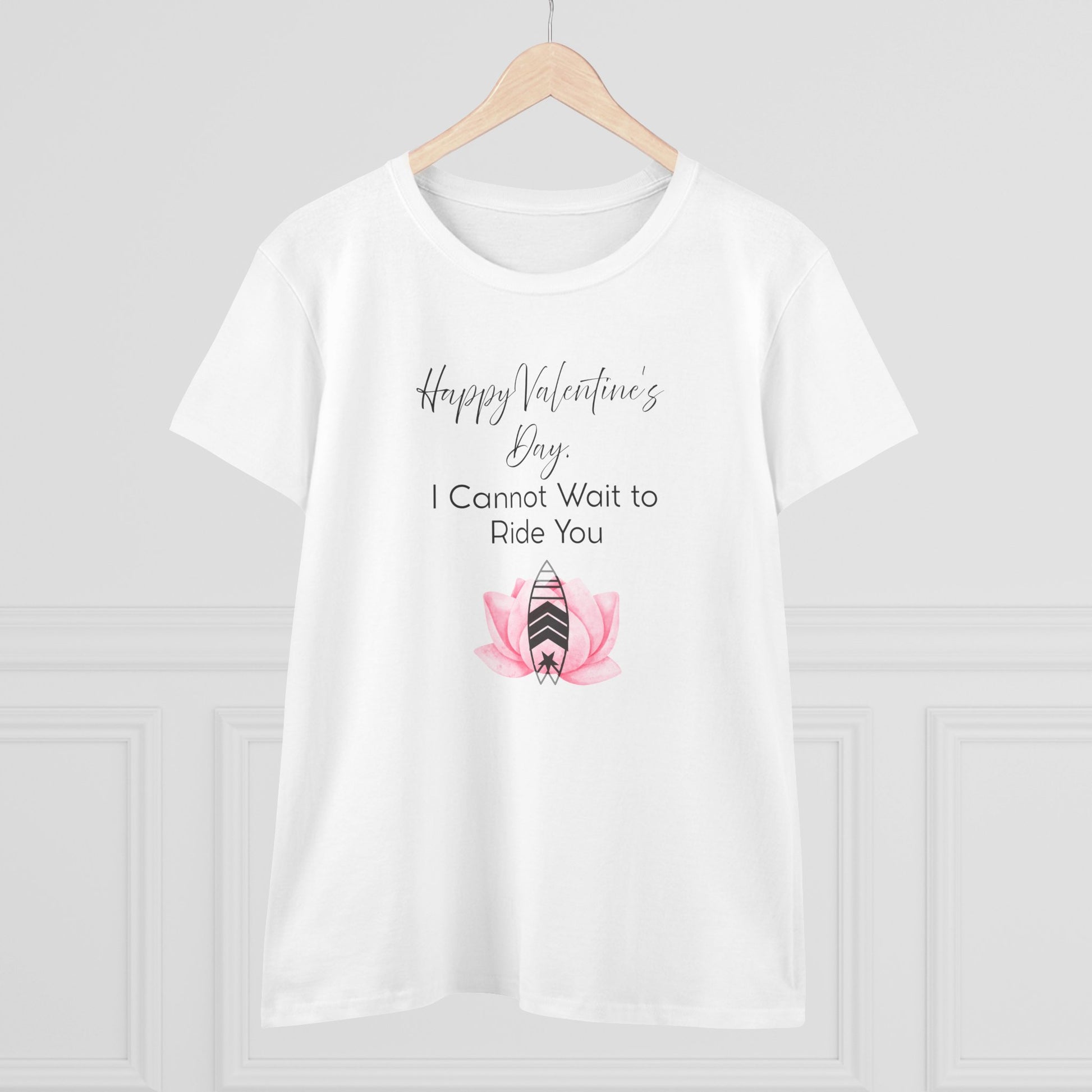White t-shirt with Valentine's Day design on a wooden hanger against a white background