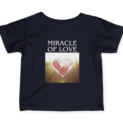 Black t-shirt with 'Miracle of Love' text and heart design on a white background