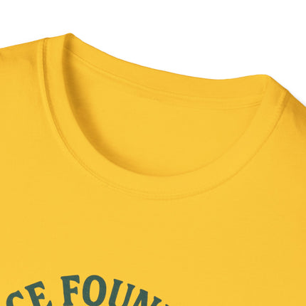 Close-up of a tagless yellow shirt with text on a white background