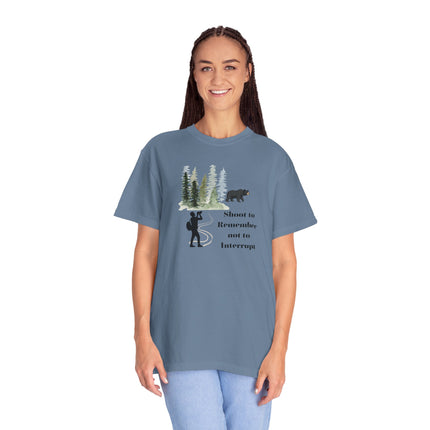 Woman wearing a blue t-shirt with a graphic design and text on a white background