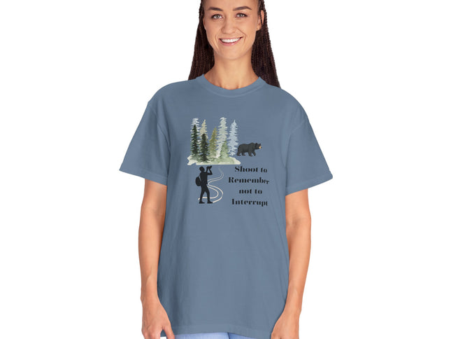 Woman wearing a blue t-shirt with a graphic design and text on a white background
