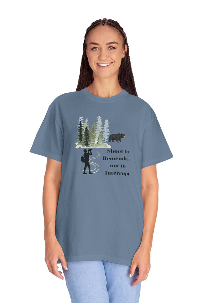 Woman wearing a blue t-shirt with a graphic design and text on a white background