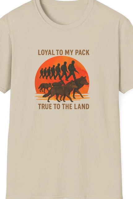 Sandy t-shirt with graphic design of soldiers and wolves. Text states Loyal to my Pack, True to the Land. 