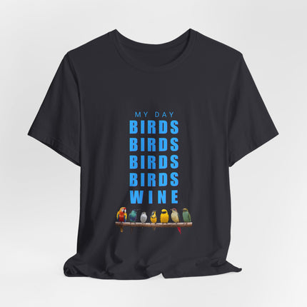 A black short-sleeve t-shirt with a graphic print on the front. The graphic features the text 'MY DAY BIRDS BIRDS BIRDS BIRDS WINE' in blue, with a row of colorful birds perched on a branch at the bottom.