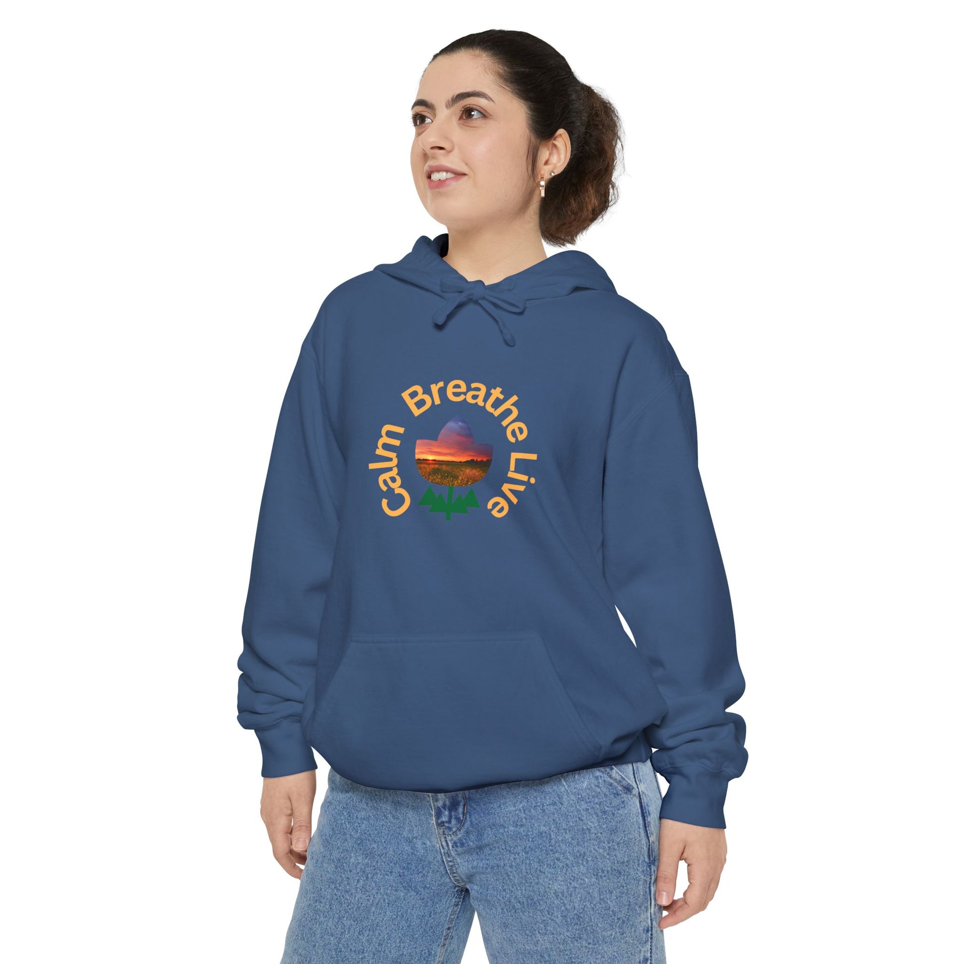 Person wearing a blue hoodie with a colorful design and text on a white background